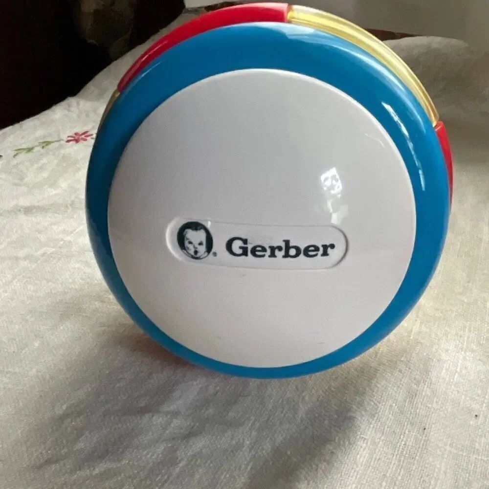1996, Ring ‘n Roll Gerber Products Co. Toy Biz, Inc roundish rolling rattle infa